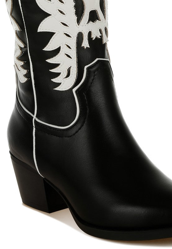Black cowboy boot with white embroidery on a white background