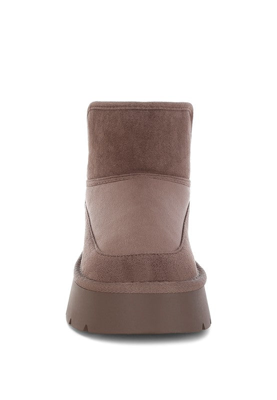 Brown ankle boot on a white background