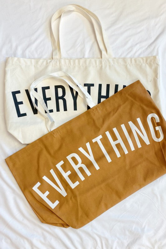 Beige tote bag and brown pouch with 'EVERYTHING' text on a white background
