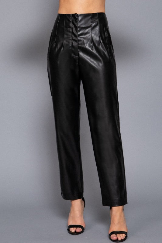 Black leather pants on a gray background