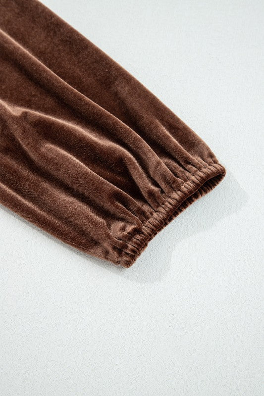 Brown velvet fabric on a white background