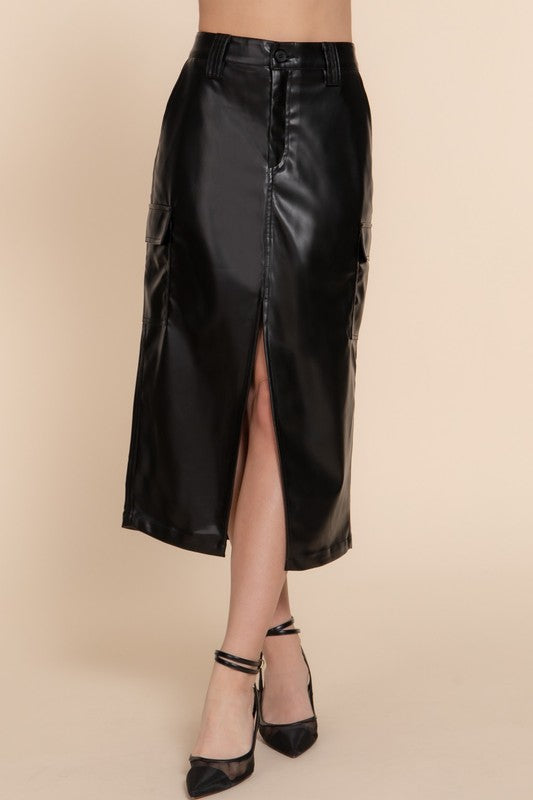 Black leather skirt worn by a person on a beige background