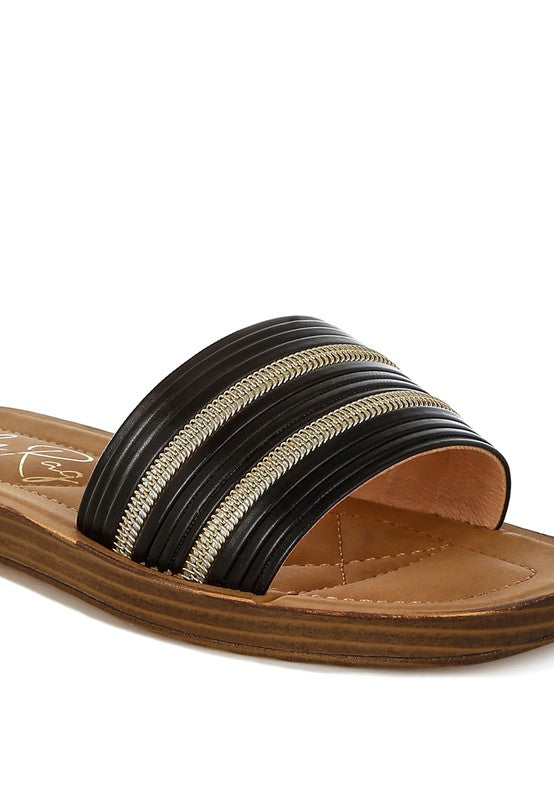 Black and gold sandal on a white background