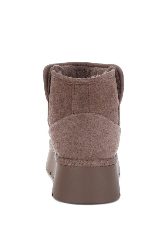 Brown suede ankle boot on a white background