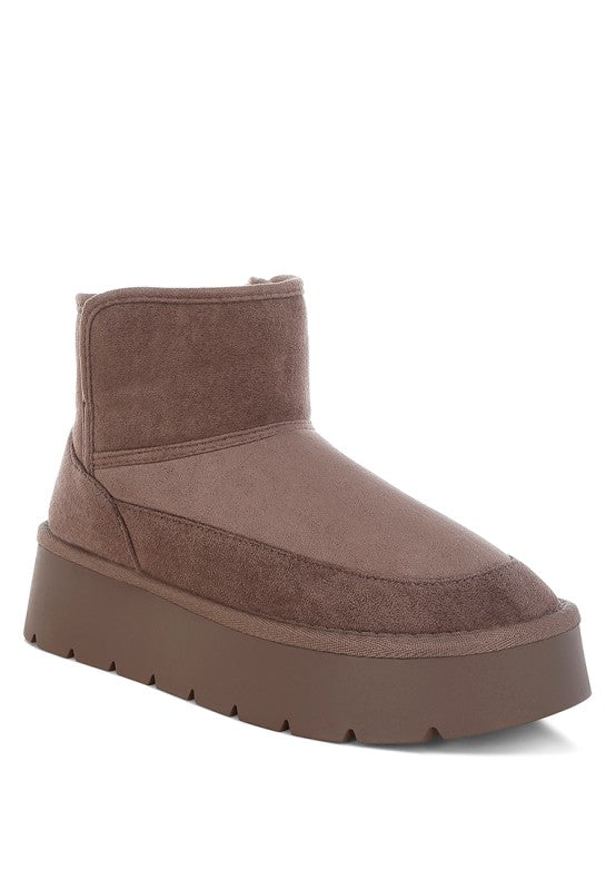 Brown suede platform boot on a white background