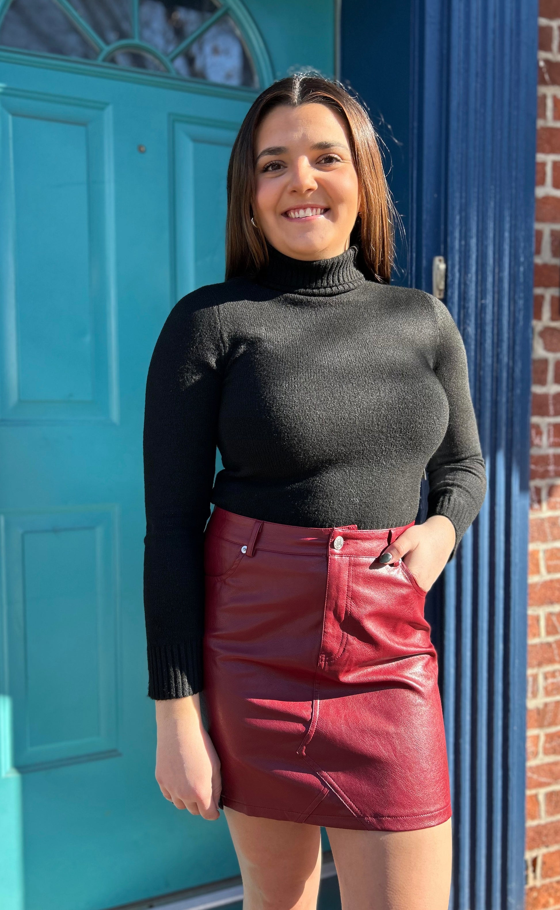 Black turtle neck, long sleeve, knit top with ribbed, ham, and semi cropped length