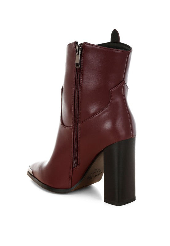 Maroon ankle boot with a block heel on a white background