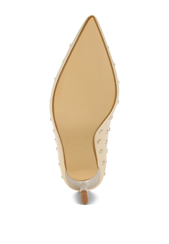 Close-up of a high-heeled shoe with a pointed toe on a white background