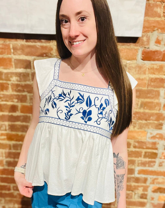 White Ruffle Sleeve Flowy Top with Blue Embroidered Detailing at Bust