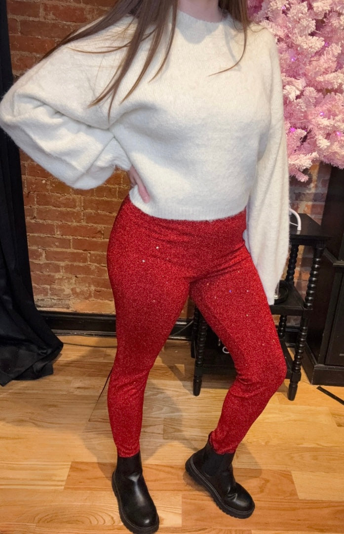 Red Sequin Leggings Paired with Black Boots and White Cropped Sweater Top