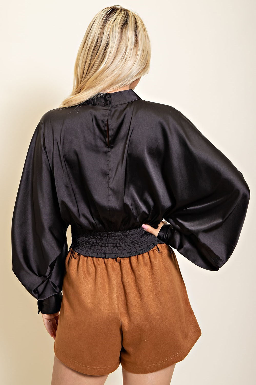 Black High Collar Balloon Sleeve Top with Button Closure in the Back.