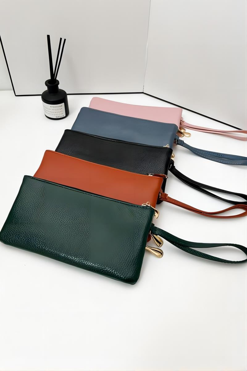 Set of colorful wallets on a white surface with a minimal background