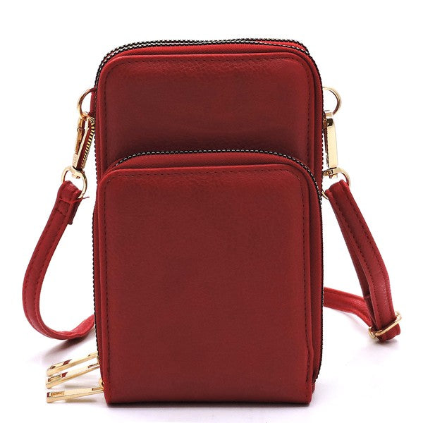 Red crossbody bag with gold accents on a white background