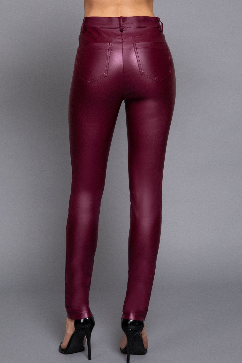 Maroon leather leggings on a gray background