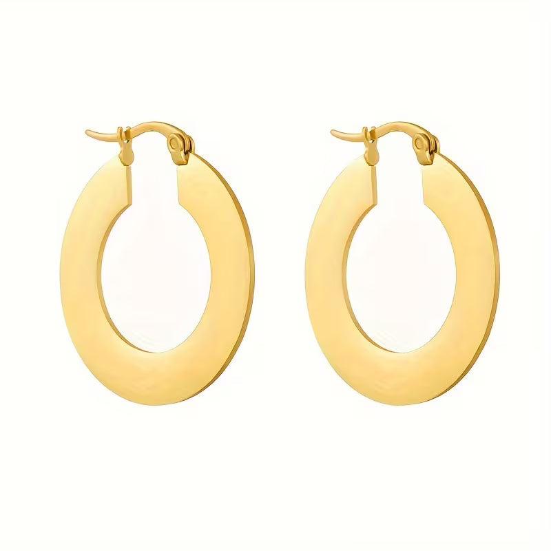 A pair of gold hoop earrings with a polished, wide oval design and lever-back closures, shown on a plain white background.