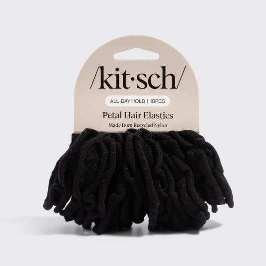 Black hair elastics with 'Akit'sch' packaging on a light gray background