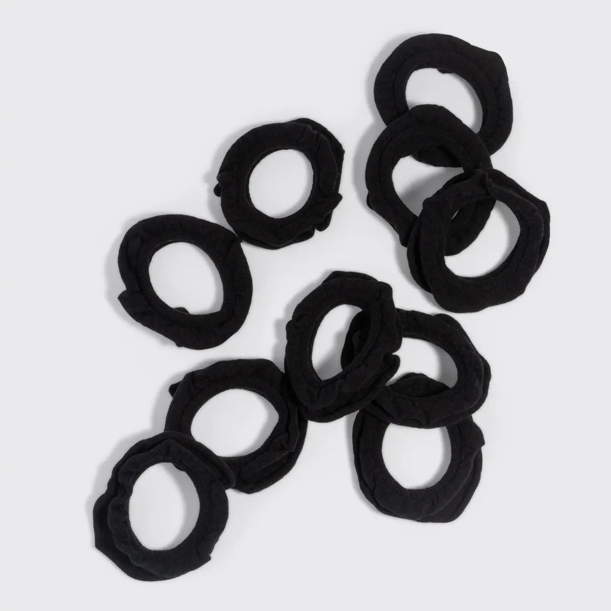 Black scrunchies on a white background