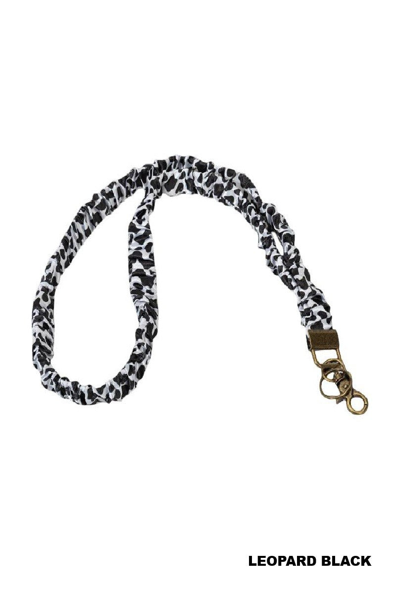 Leopard print lanyard with a metal clip on a white background