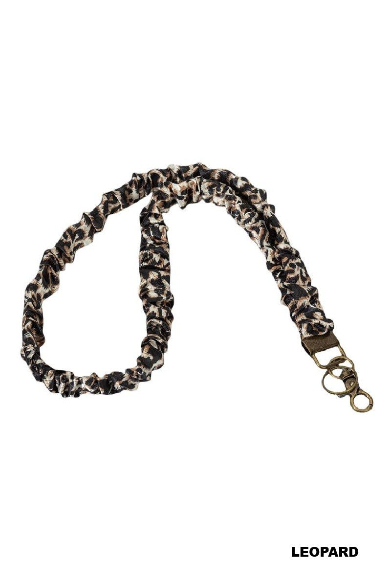 Leopard print bag strap on a white background