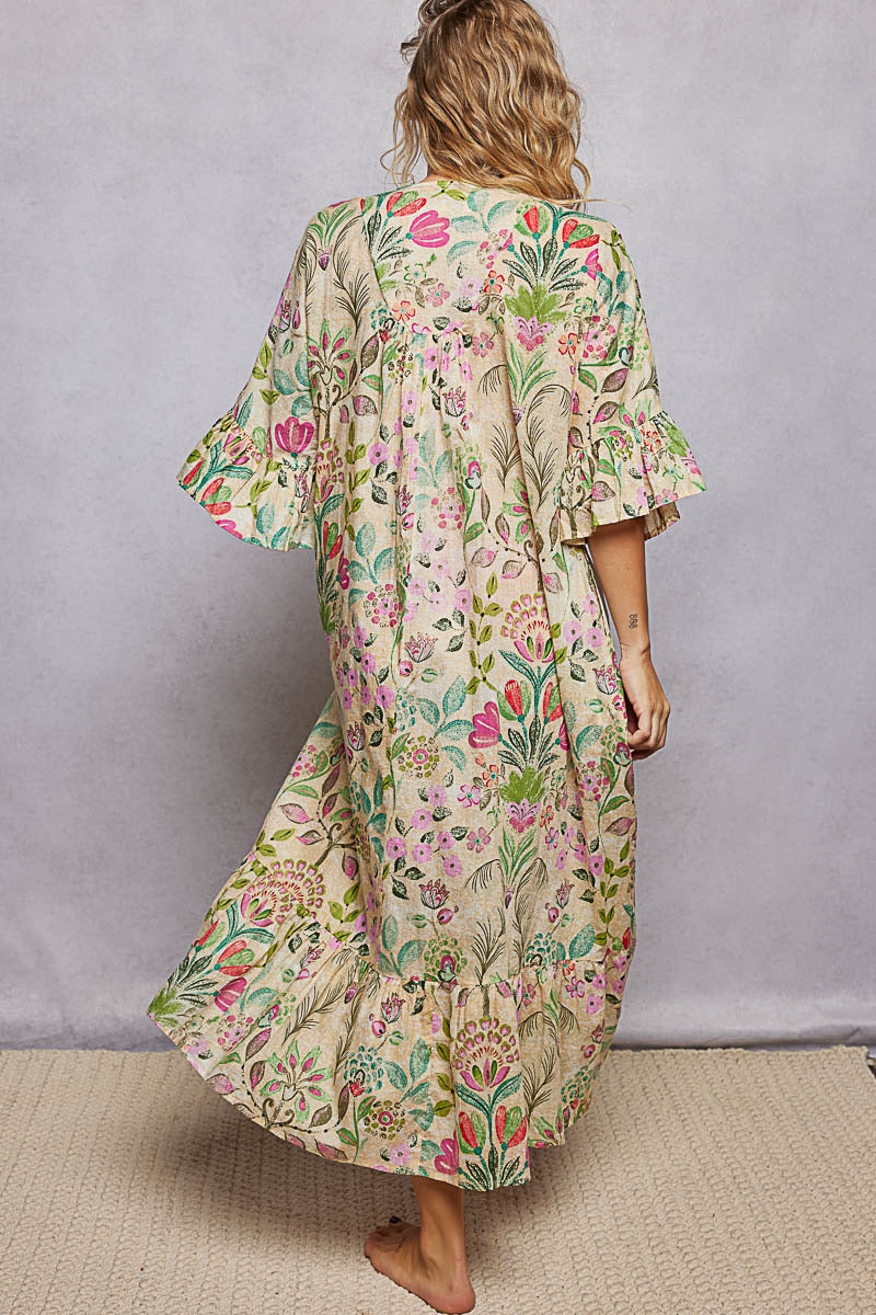 Woman wearing a floral dress with a plain background