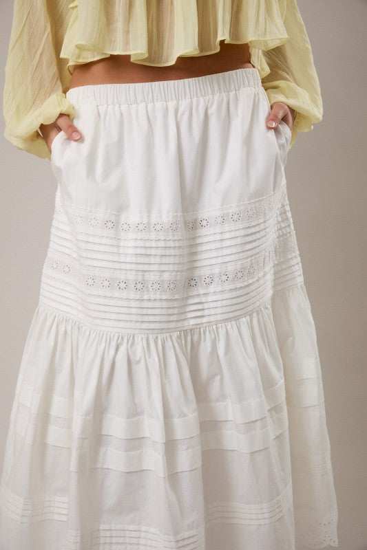 White lace-trimmed skirt with a plain background