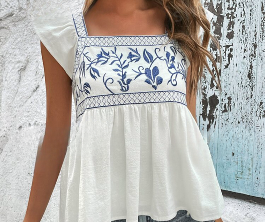 White Ruffle Sleeve Flowy Top with Blue Embroidered Detailing at Bust