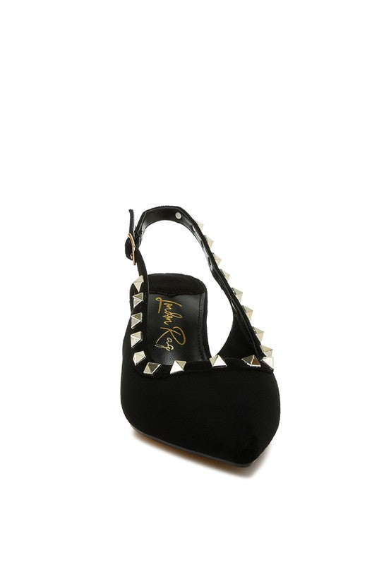 Black high-heeled shoe with studded details on a white background