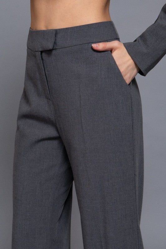 Gray pants worn by a person on a gray background