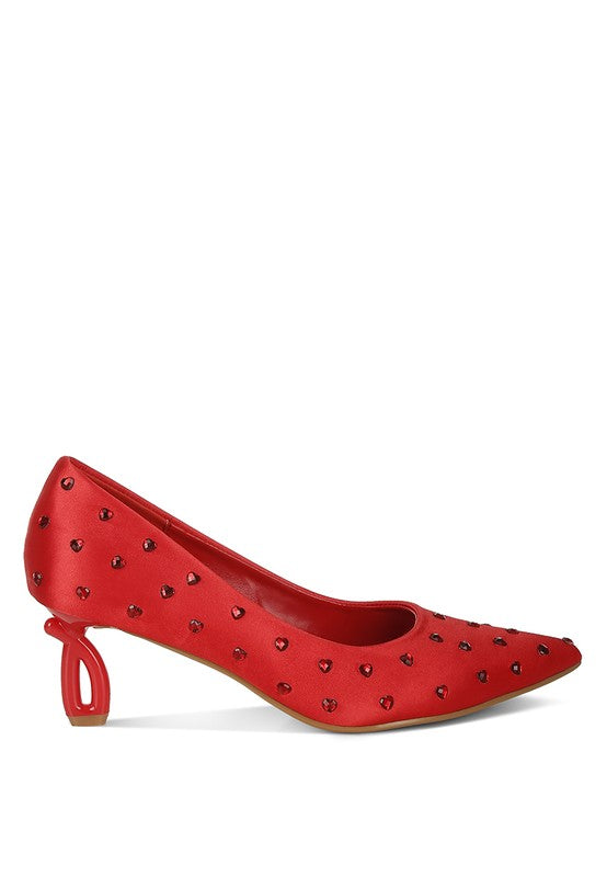 Red studded high heel shoe on a white background