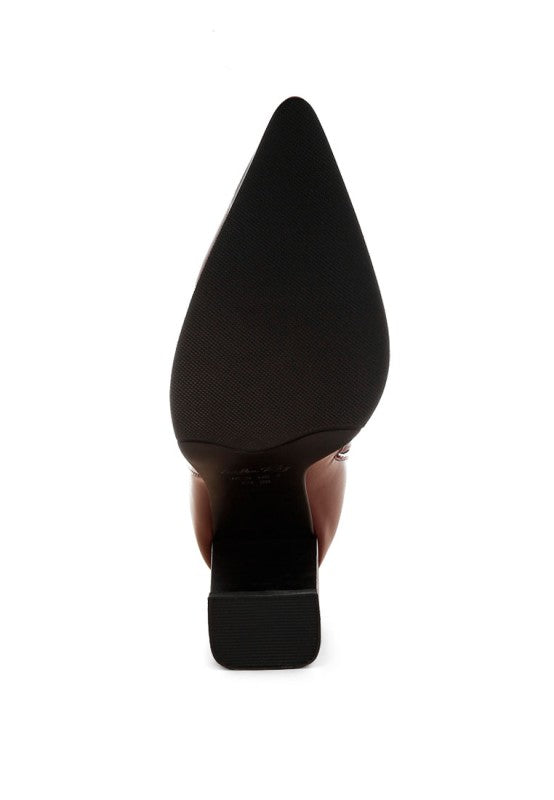 Black pointed-toe high heel shoe on a white background