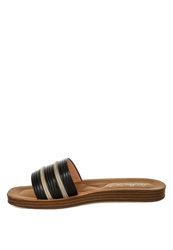 Single sandal with striped design on a white background