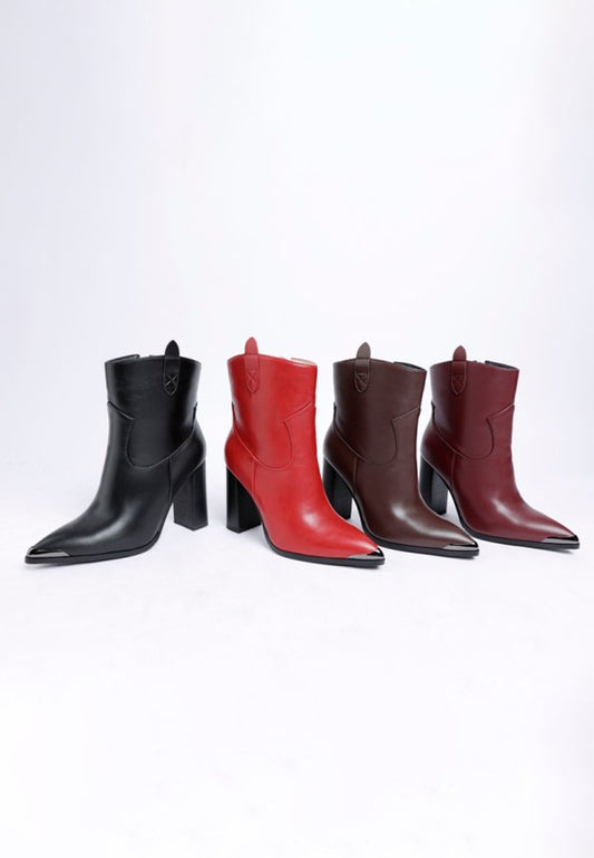 Four pairs of leather boots in black, red, brown, and burgundy on a white background