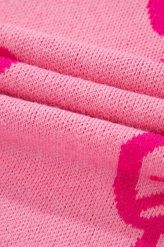 Close-up of pink fabric with a pattern, possibly socks or a towel.