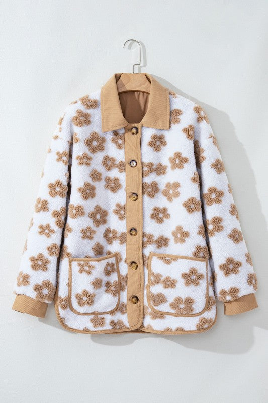 Floral patterned jacket with beige accents on a white background