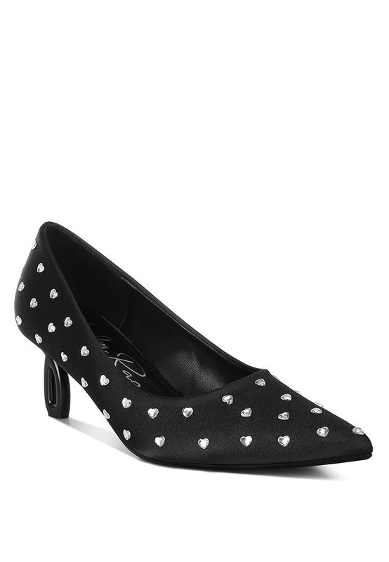 Black high heel shoe with silver studded details on a white background