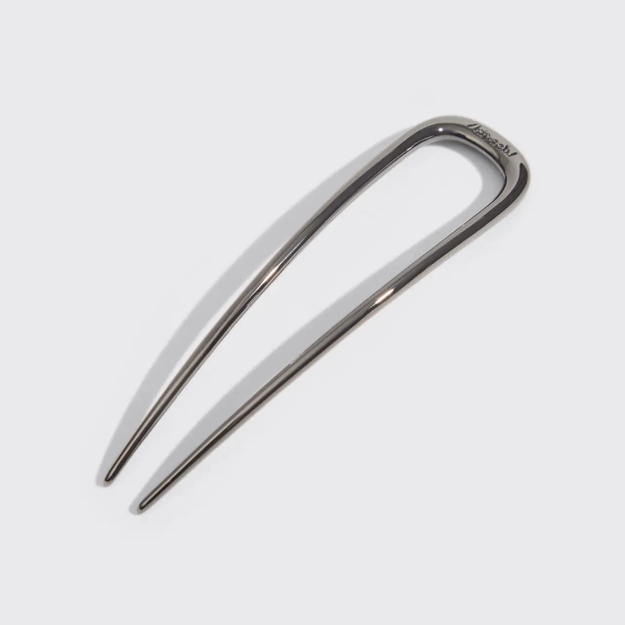 Metallic hair clip on a white background