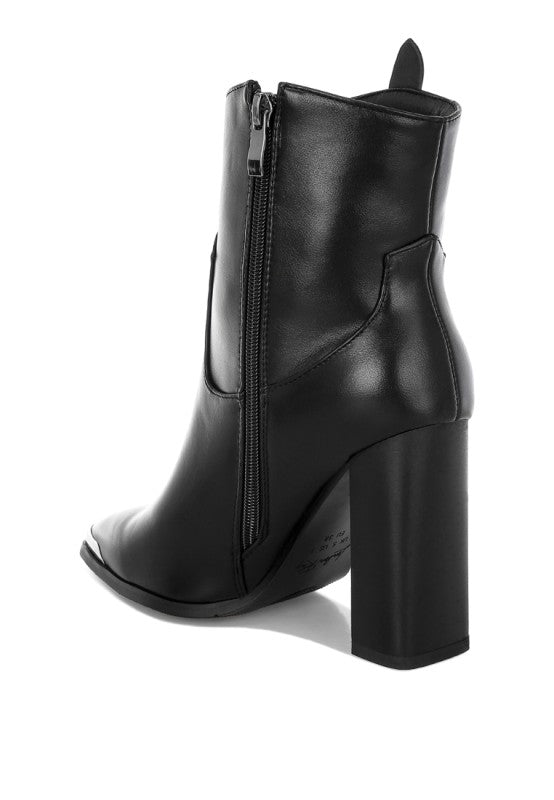 Black leather ankle boot with block heel on a white background