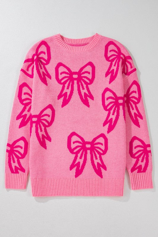 Pink sweater with large pink bows on a light gray background