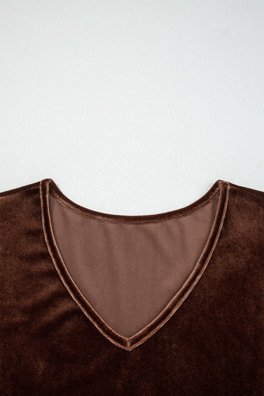 Brown velvet garment with a V-neck on a white background