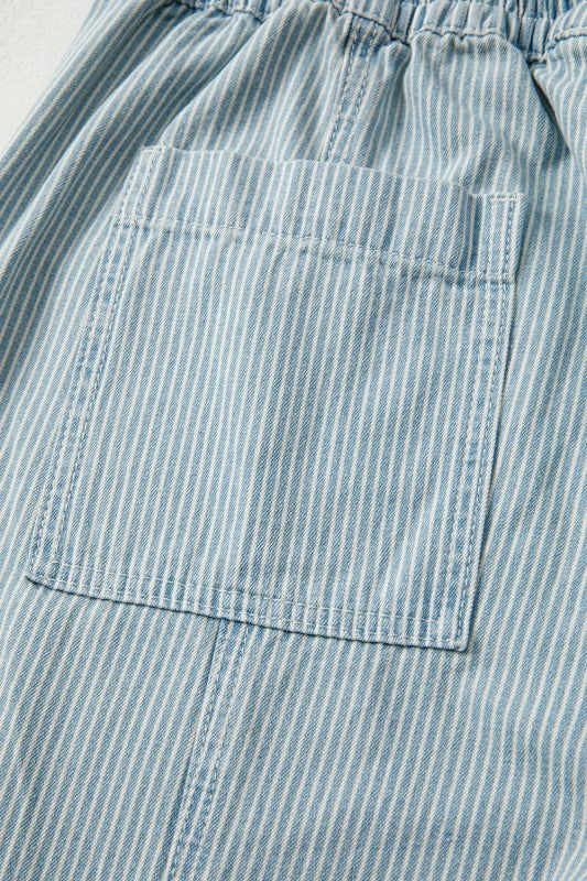 Close-up of a blue and white striped fabric with a pocket.
