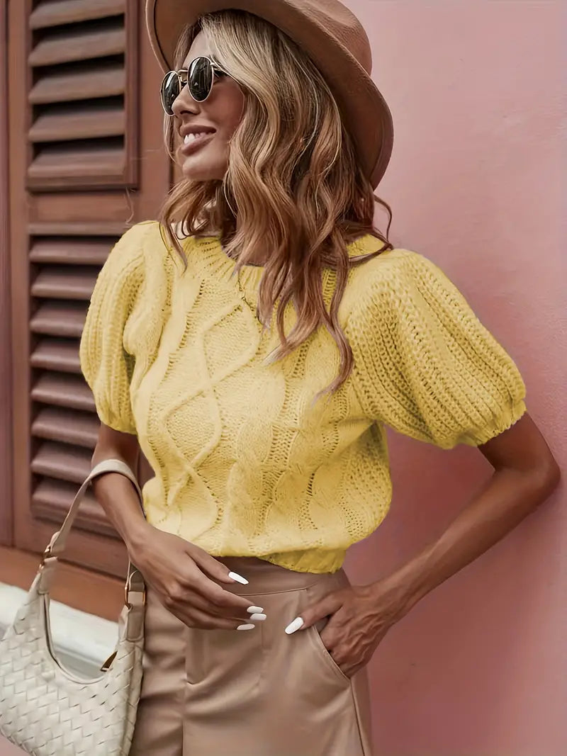 Yellow top with short cap sleeves and a twist pattern through the bodice with a crew neckline