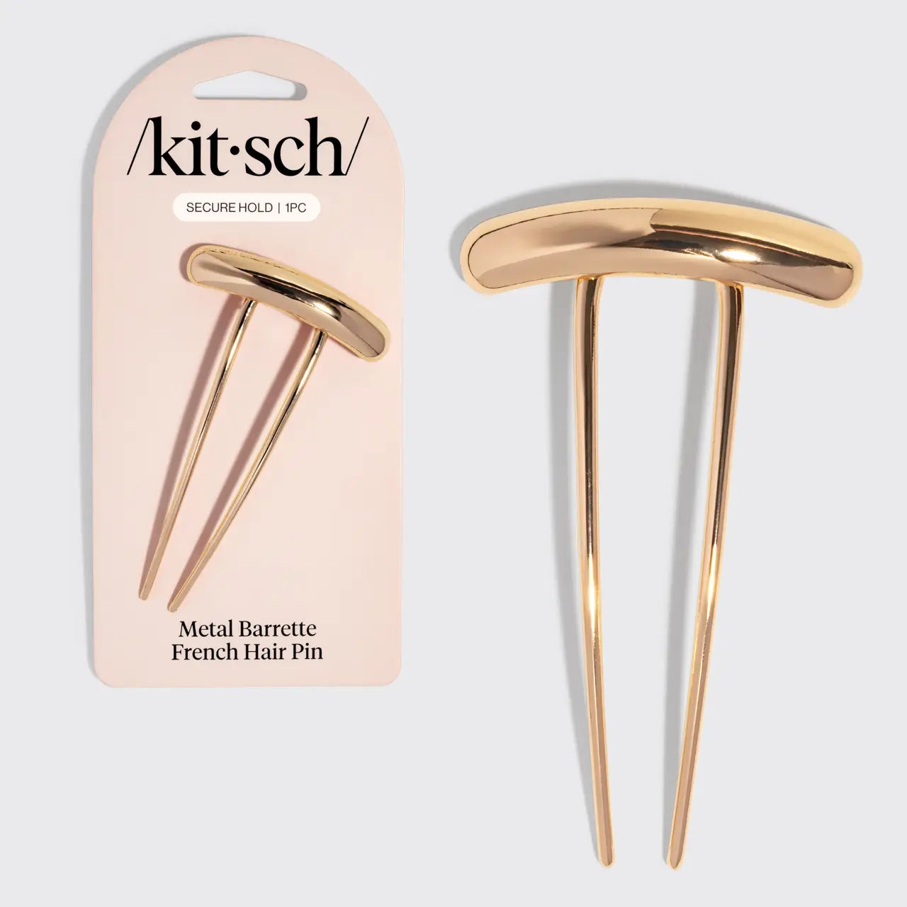 Gold metal hair pin with packaging displaying 'kitsch' brand on a light gray background