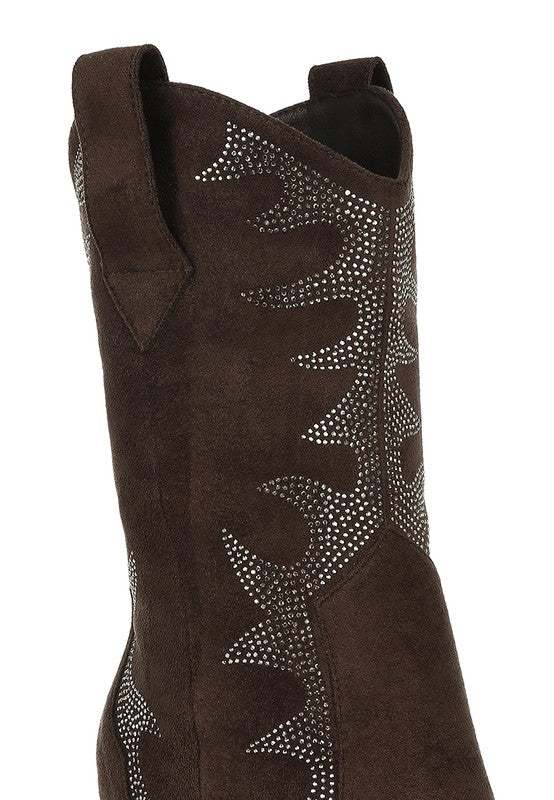 Black cowboy boot with decorative pattern on a white background