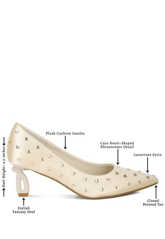 Beige high-heeled shoe with rhinestone details on a white background
