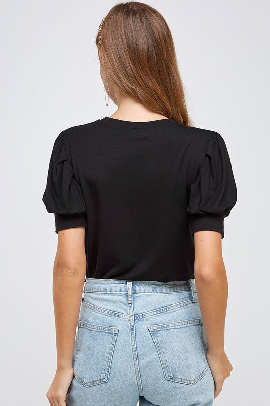 Feeling Sweet Tee with Crew Neckline and Puffed, Pleated Short Sleeves and Relaxed Bodice Color Black.