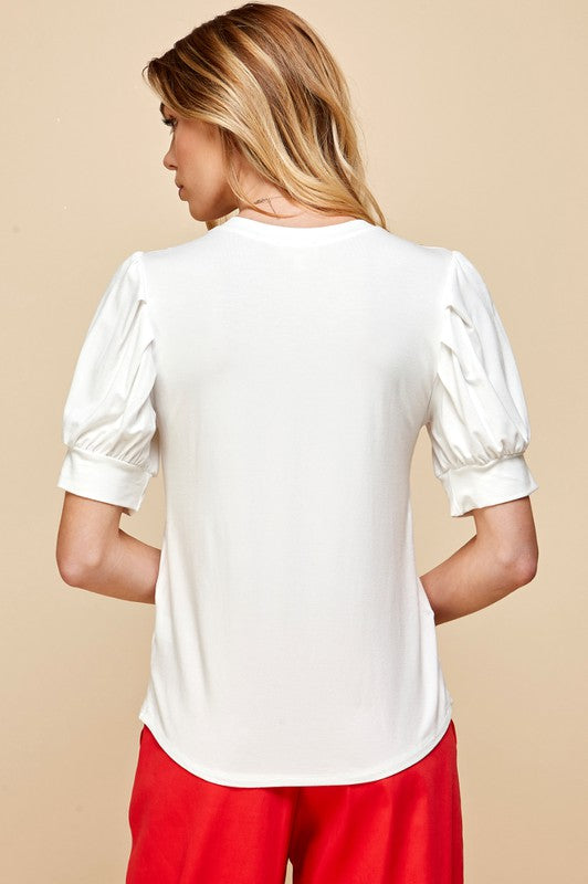 Feeling Sweet Tee with Crew Neckline and Puffed, Pleated Short Sleeves and Relaxed Bodice Color White.